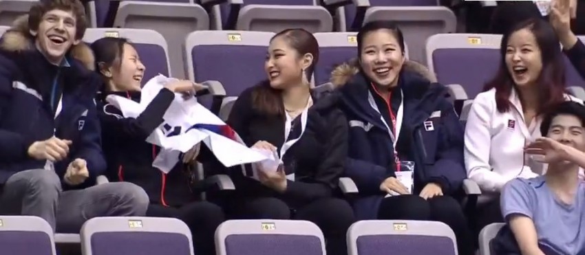 Team Korea cheering at 2016 4CC Men SP ice resurfacing.jpg